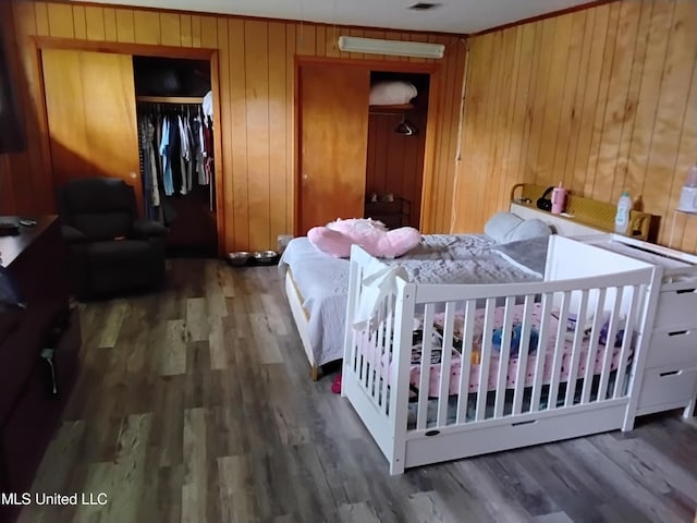 807 Line Dr, Forest, MS 39074 - bedroom featuring wood finished floors and wood walls