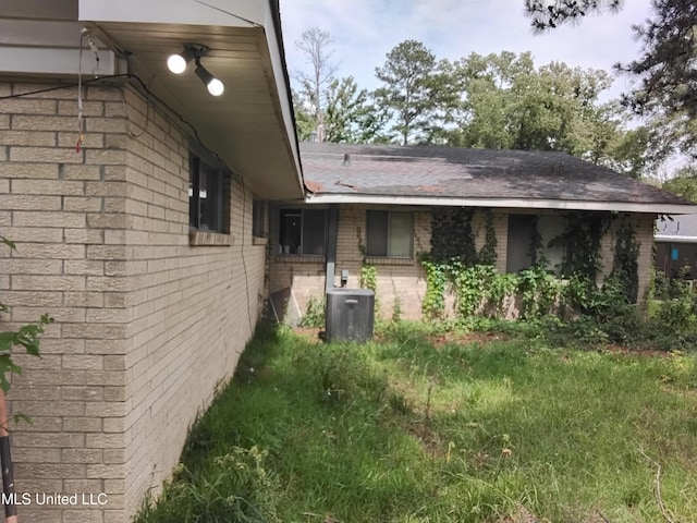 807 Line Dr, Forest, MS 39074 - view of home's exterior with brick siding and roof with shingles