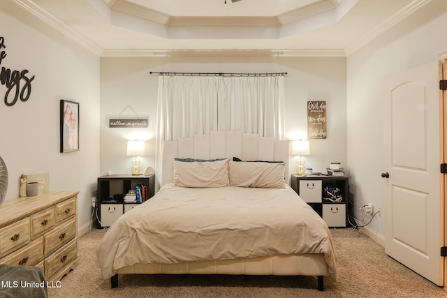 bedroom with light colored carpet, ornamental molding, and a raised ceiling