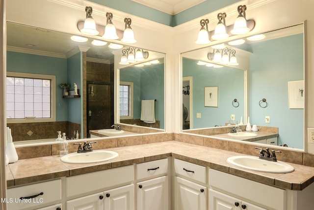 bathroom featuring ornamental molding, an enclosed shower, and vanity