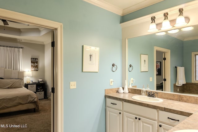 bathroom with ornamental molding and vanity