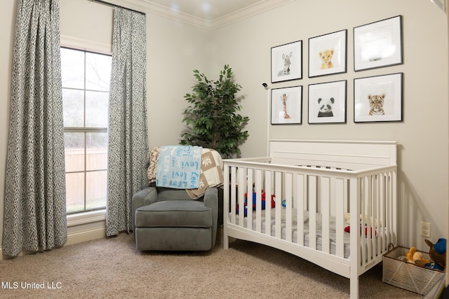 carpeted bedroom with multiple windows, crown molding, and a crib