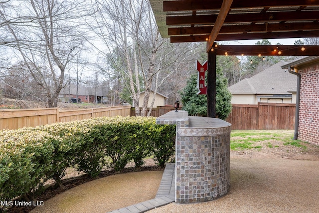 view of patio / terrace featuring a pergola and exterior bar