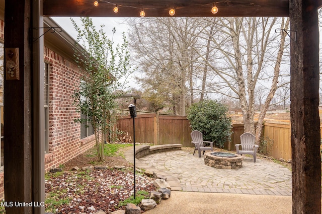 view of patio / terrace with an outdoor fire pit