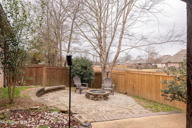 view of patio with a fire pit