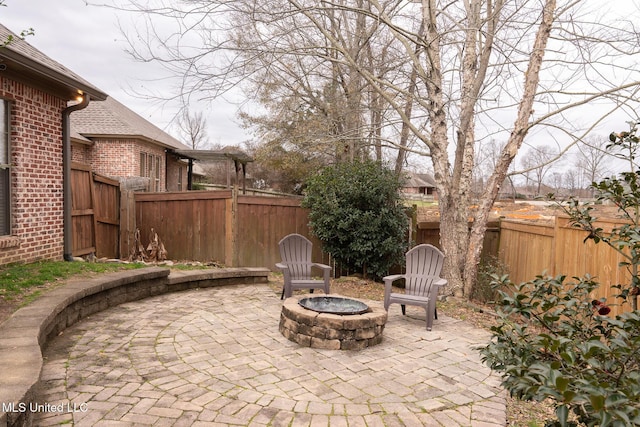 view of patio with an outdoor fire pit