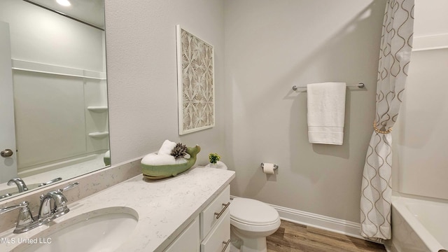 full bathroom with toilet, vanity, shower / tub combo, and hardwood / wood-style flooring