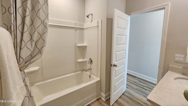 bathroom featuring shower / bath combination with curtain and hardwood / wood-style flooring