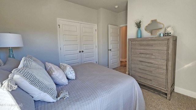 carpeted bedroom featuring a closet