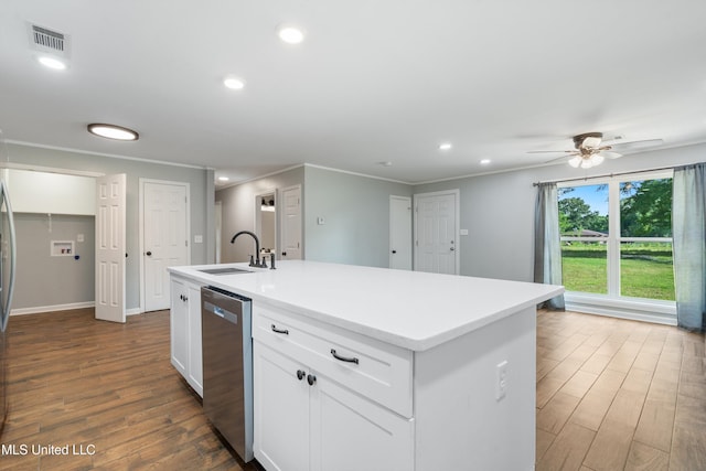 kitchen with a sink, dishwasher, dark wood-style floors, crown molding, and white cabinetry