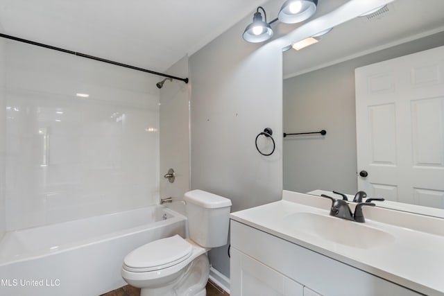 bathroom featuring toilet, vanity, and bathtub / shower combination