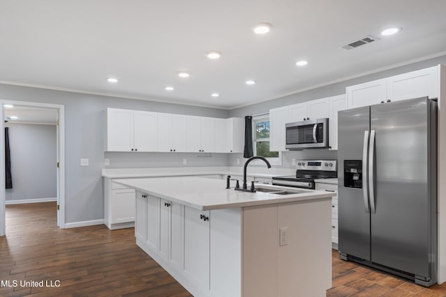 kitchen with appliances with stainless steel finishes, a sink, crown molding, white cabinetry, and dark wood-style flooring
