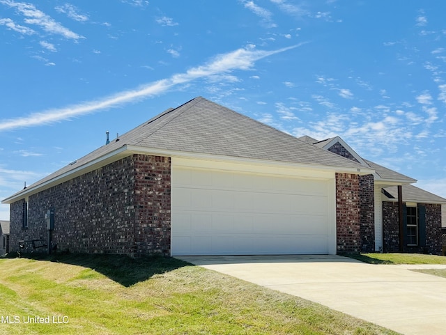 536 Fairway Ave, Byram, MS 39272 - view of front of house with brick siding, concrete driveway, a garage, and a front yard