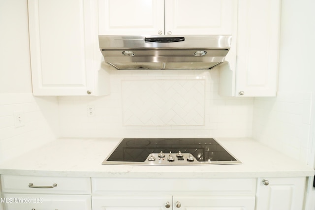 kitchen featuring decorative backsplash, white cabinetry, ventilation hood, and black electric stovetop