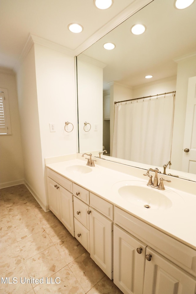 bathroom with double vanity, recessed lighting, ornamental molding, and a sink