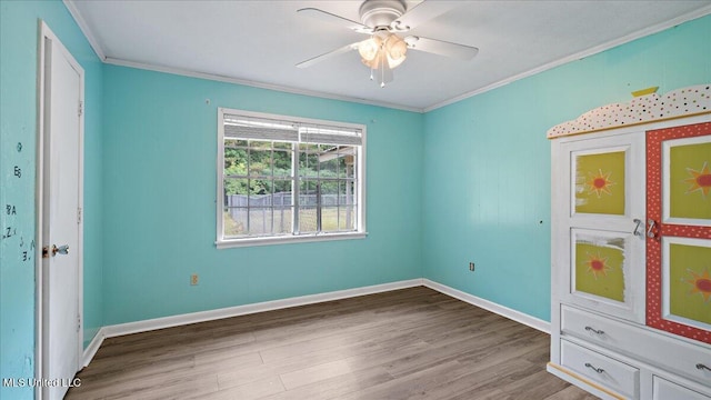 3222 Stage Rd, Morton, MS 39117 - unfurnished bedroom with crown molding, wood finished floors, and ceiling fan