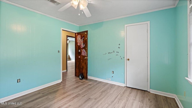 3222 Stage Rd, Morton, MS 39117 - unfurnished bedroom featuring wood finished floors, crown molding, and ceiling fan