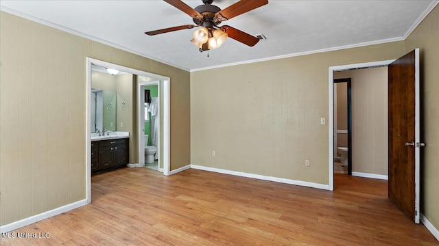 3222 Stage Rd, Morton, MS 39117 - unfurnished bedroom with light wood-style flooring, crown molding, ensuite bathroom, and a ceiling fan