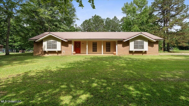 3222 Stage Rd, Morton, MS 39117 - single story home featuring a porch, a front yard, a metal roof, and brick siding