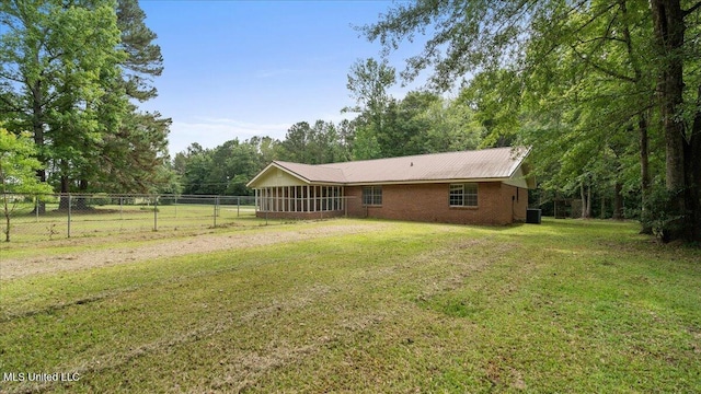 3222 Stage Rd, Morton, MS 39117 - rear view of property featuring a sunroom, brick siding, and a metal roof
