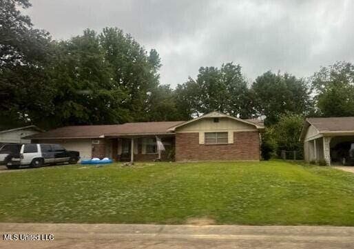1218 Springdale Dr, Jackson, MS 39211 - single story home with a front lawn and covered porch