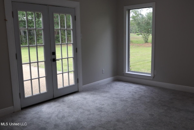 doorway to outside featuring french doors, carpet floors, healthy amount of natural light, and baseboards