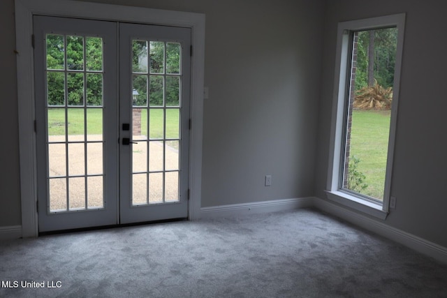 entryway with french doors, carpet flooring, and healthy amount of natural light