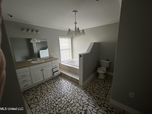 bathroom with a garden tub, a notable chandelier, ornamental molding, vanity, and baseboards