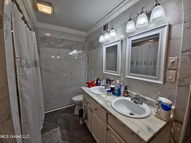 full bath featuring toilet, double vanity, a sink, and crown molding