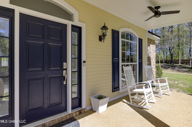 doorway to property with covered porch and ceiling fan