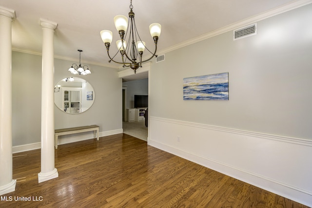 unfurnished dining area with decorative columns, dark wood-type flooring, and crown molding