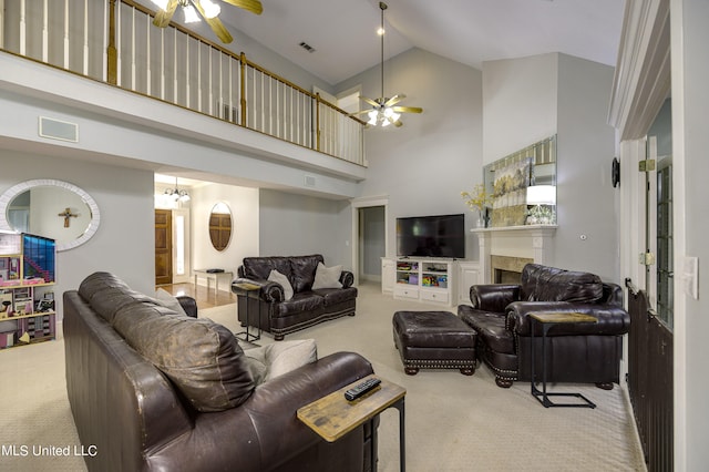 carpeted living room featuring high vaulted ceiling and ceiling fan