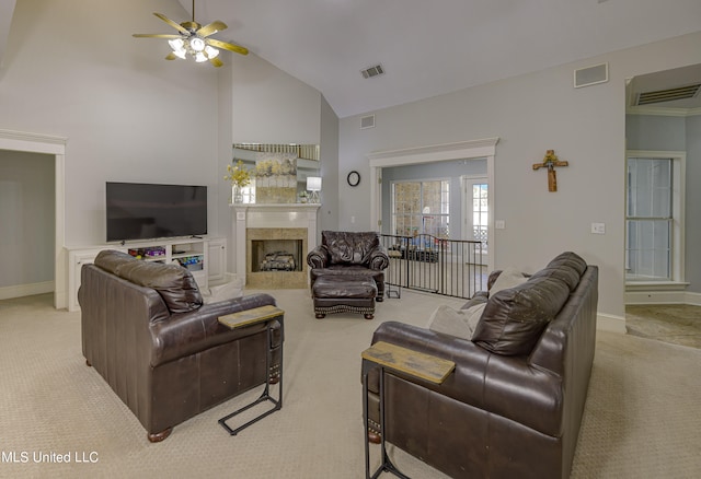 living room featuring light colored carpet, high vaulted ceiling, and ceiling fan