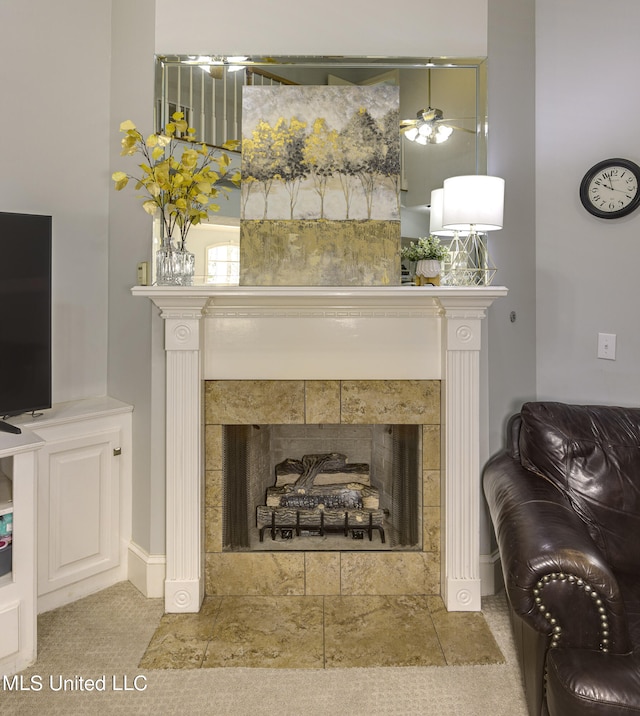 details with carpet, a fireplace, and ceiling fan