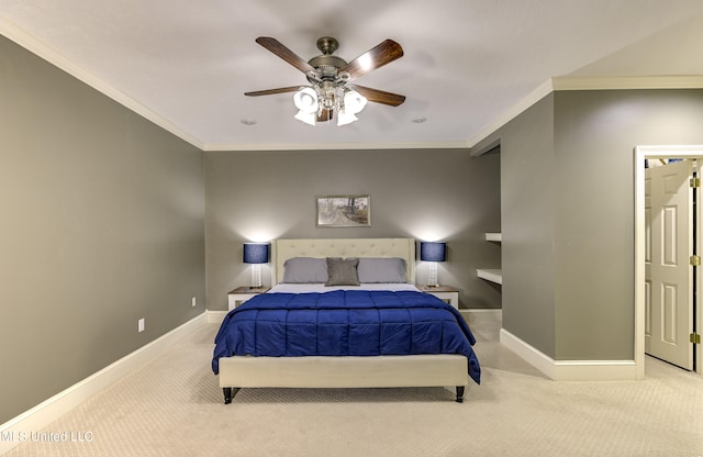 carpeted bedroom with ceiling fan and crown molding