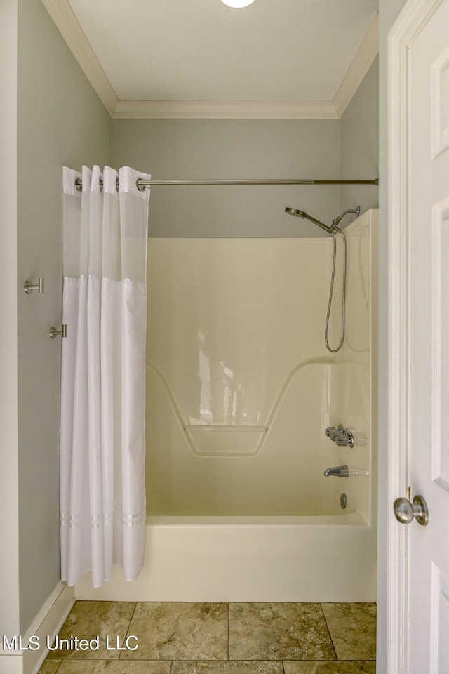 bathroom featuring ornamental molding and shower / tub combo with curtain