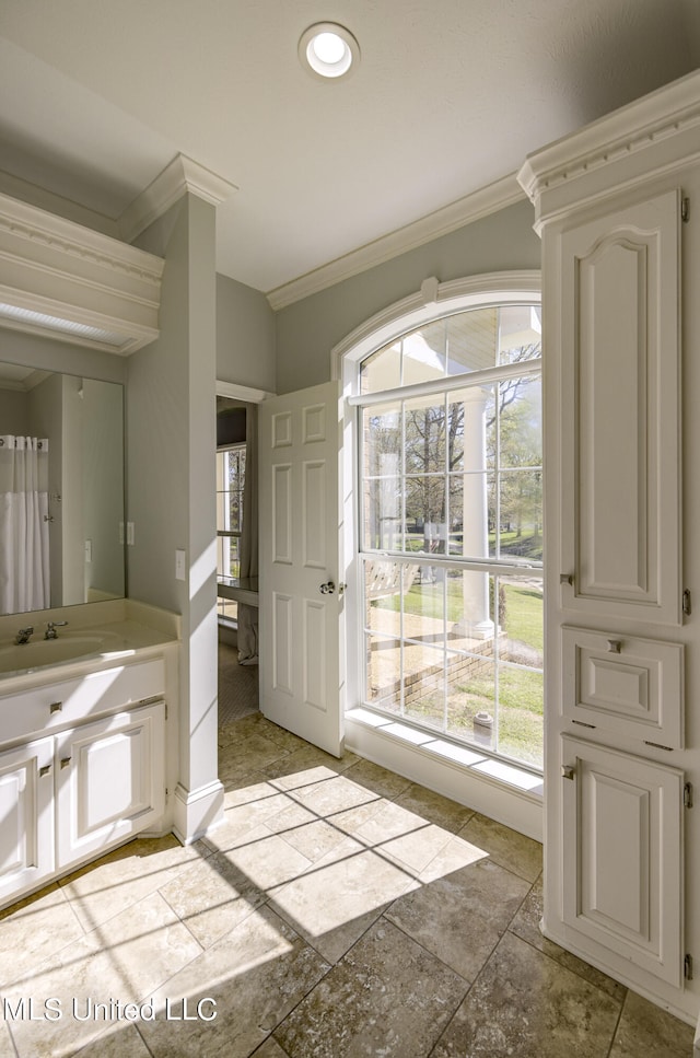 bathroom featuring vanity and crown molding