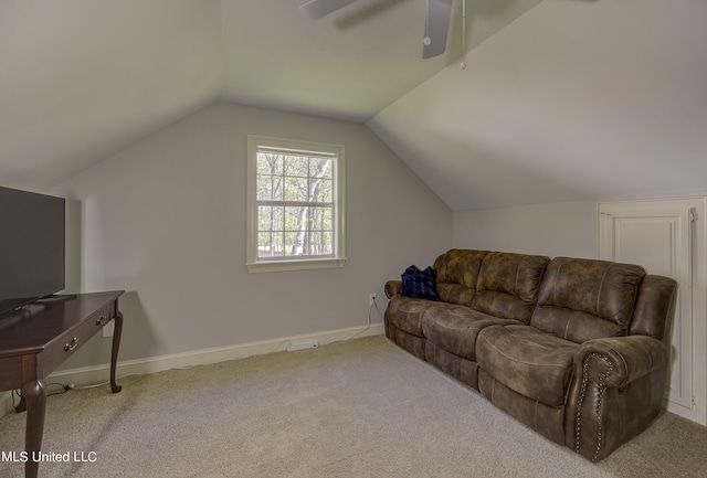 carpeted living room with vaulted ceiling and ceiling fan