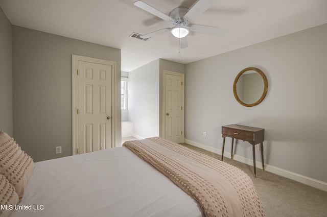 bedroom featuring connected bathroom, carpet, and ceiling fan