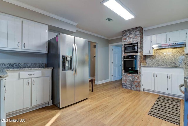 kitchen featuring wall oven, stainless steel fridge, light wood-style flooring, built in microwave, and under cabinet range hood