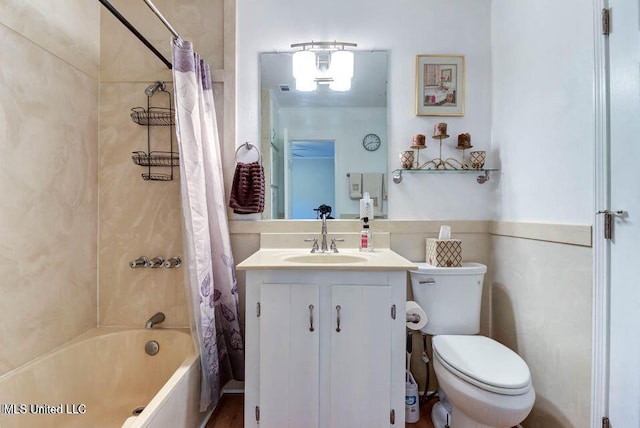 bathroom featuring shower / tub combo with curtain, vanity, and toilet