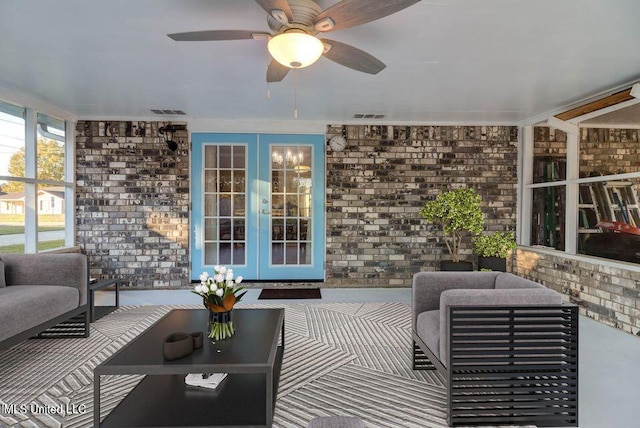 view of patio featuring visible vents, french doors, an outdoor living space, and a ceiling fan