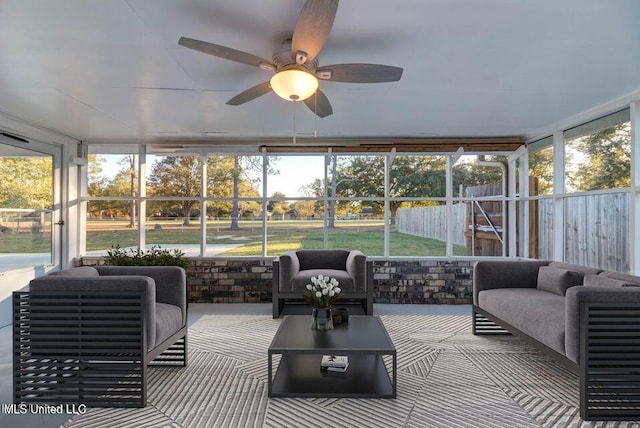 sunroom with a ceiling fan