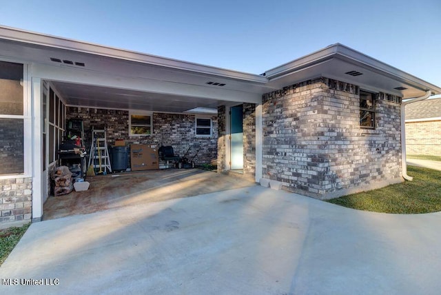 exterior space featuring concrete driveway