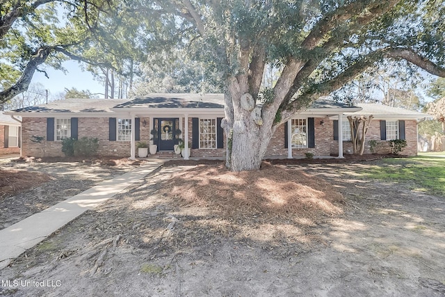 ranch-style house with brick siding