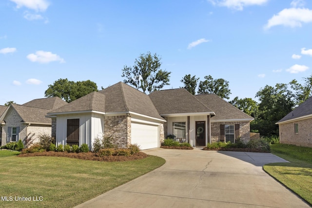 254 Buttonwood Ln, Canton, MS 39046 - view of front of property featuring brick siding, a front yard, and concrete driveway
