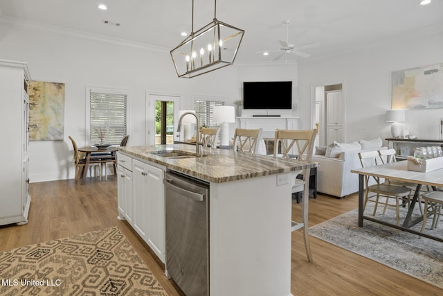 254 Buttonwood Ln, Canton, MS 39046 - kitchen with dishwasher, crown molding, white cabinetry, open floor plan, and light stone countertops