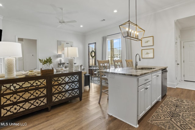 254 Buttonwood Ln, Canton, MS 39046 - kitchen featuring open floor plan, ceiling fan, recessed lighting, crown molding, and stone countertops