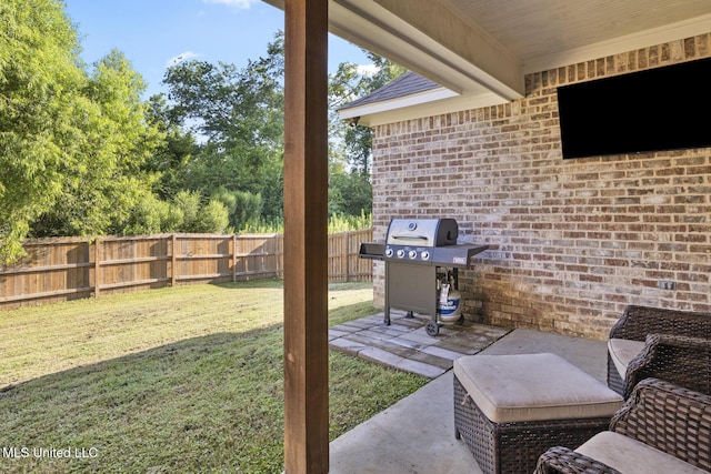 254 Buttonwood Ln, Canton, MS 39046 - fenced backyard with a grill and a patio area