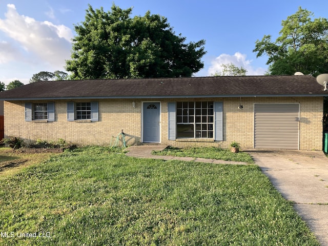 ranch-style house with brick siding, concrete driveway, a garage, and a front lawn